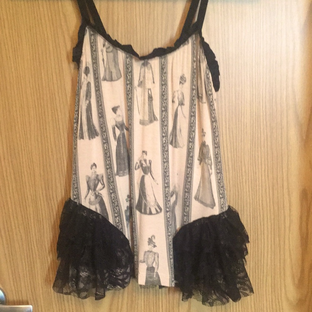 The Original Cult very unique cream camisole with black lace bustle.